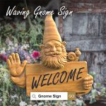Waving gnome sign in garden